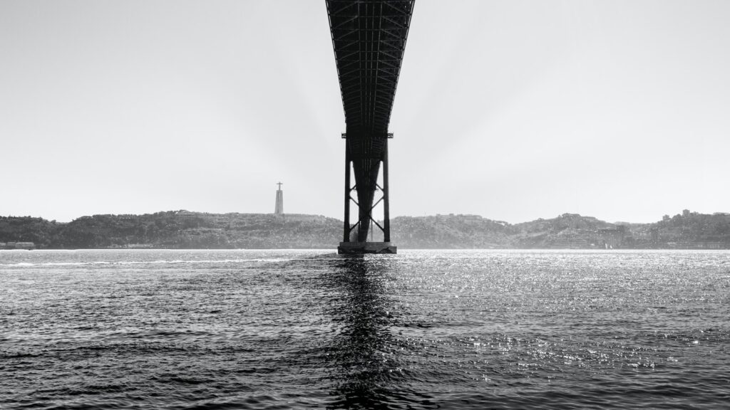 metal bridge and calm water