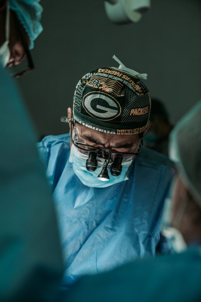 doctor wearing Green Bay Packers hat