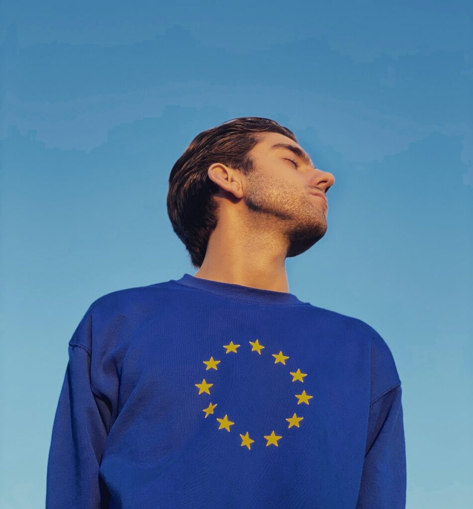 man in blue crew neck shirt under blue sky during daytime