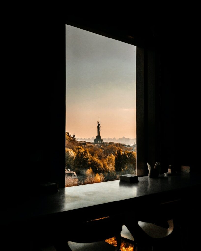 black wooden table near window panel