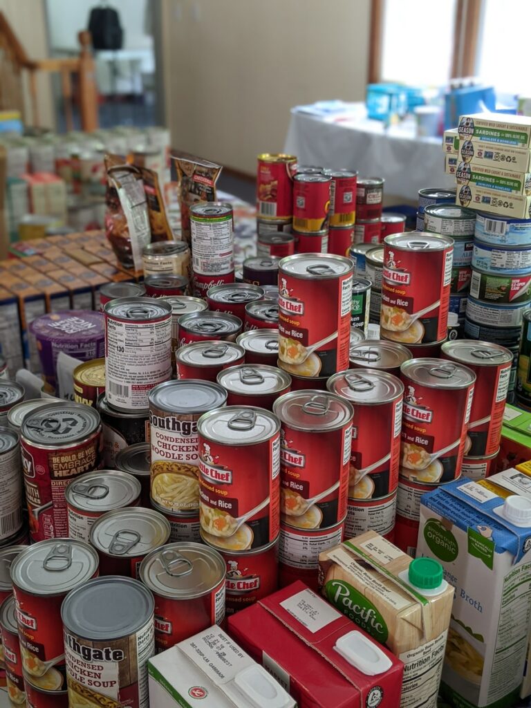 red and white labeled cans