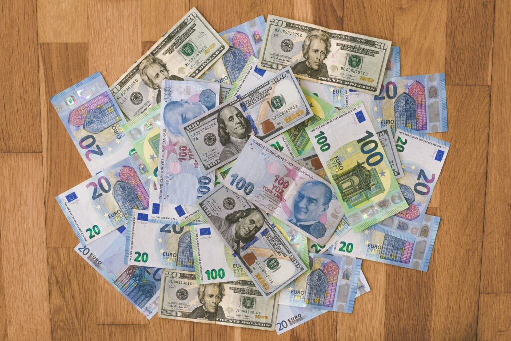 10 and 20 banknotes on brown wooden table