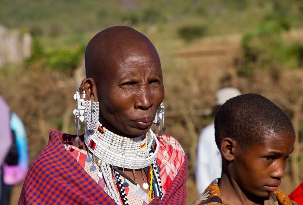 man in red and white plaid shirt wearing white scarf