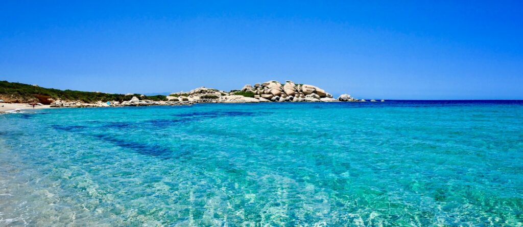 crystal blue water on white sand beach