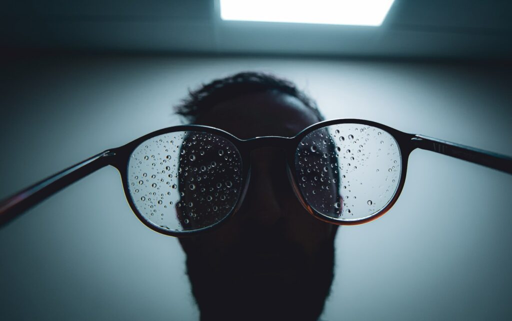 person wearing black framed sunglasses