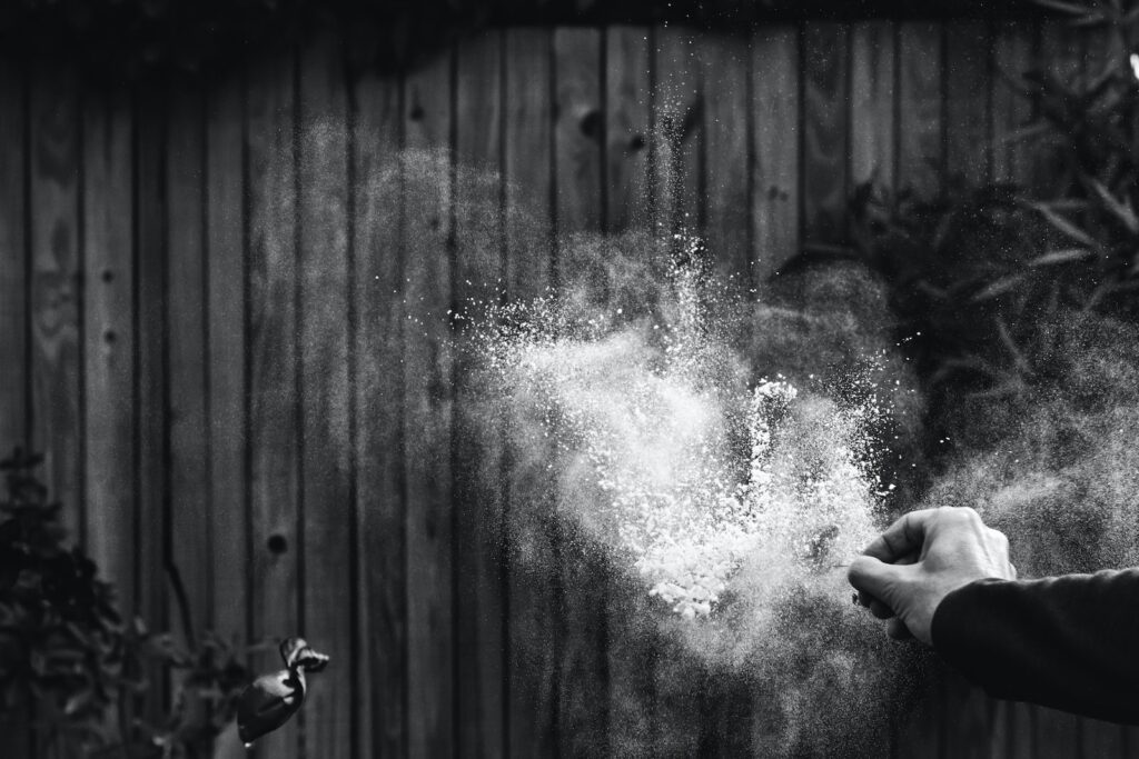 greyscale photography of powder