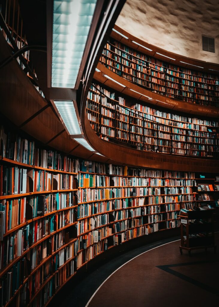 photo of brown wooden bookshelf