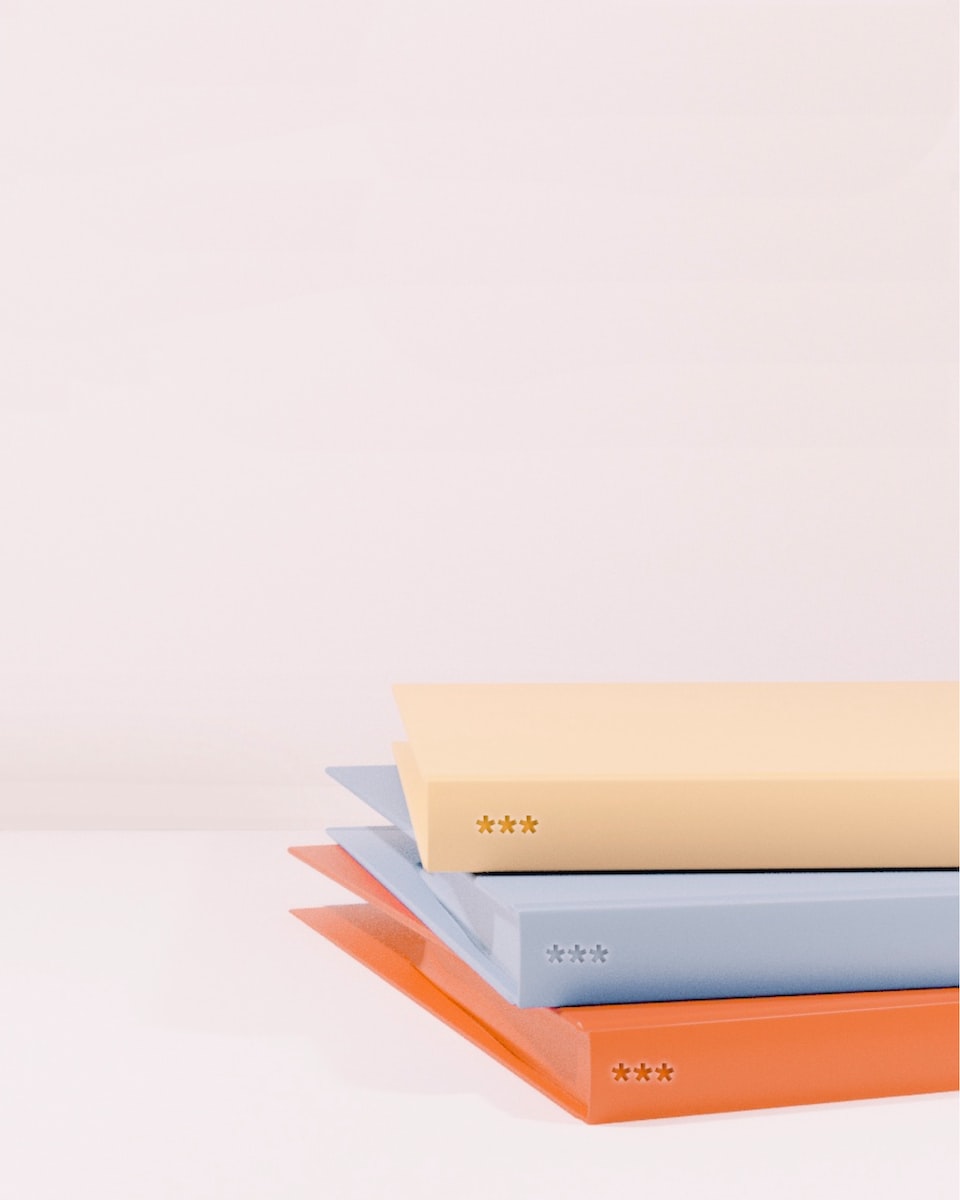 stack of books on white table