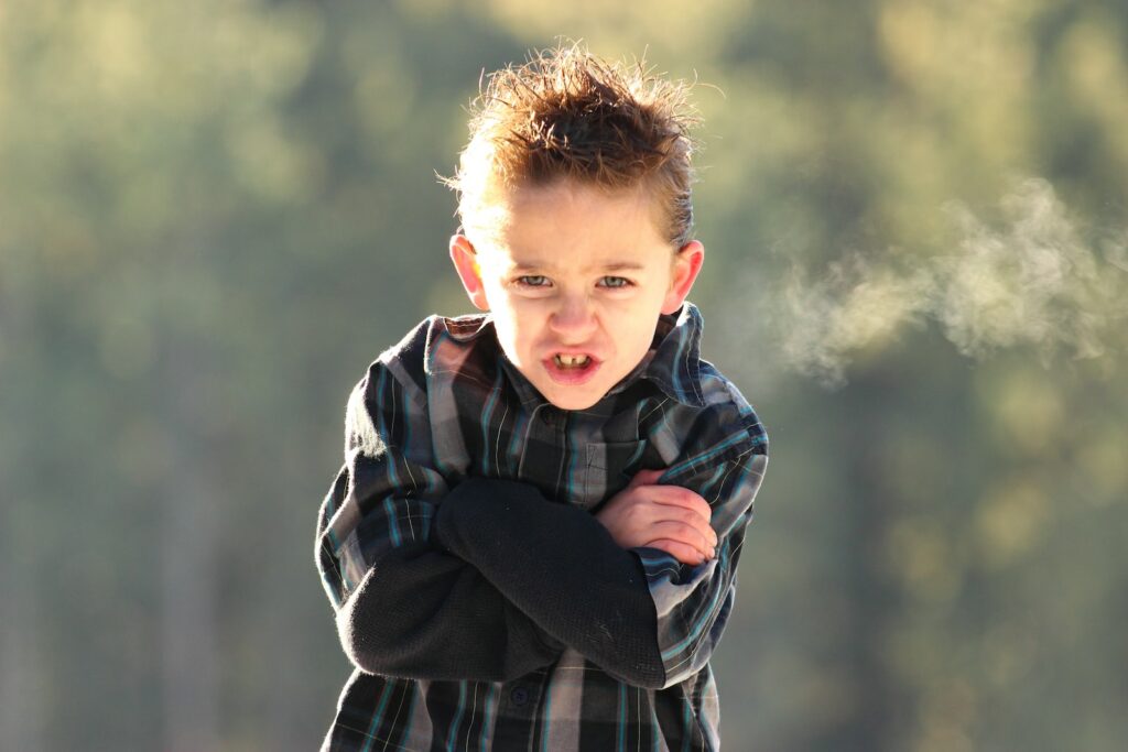 boy in black and white plaid coat