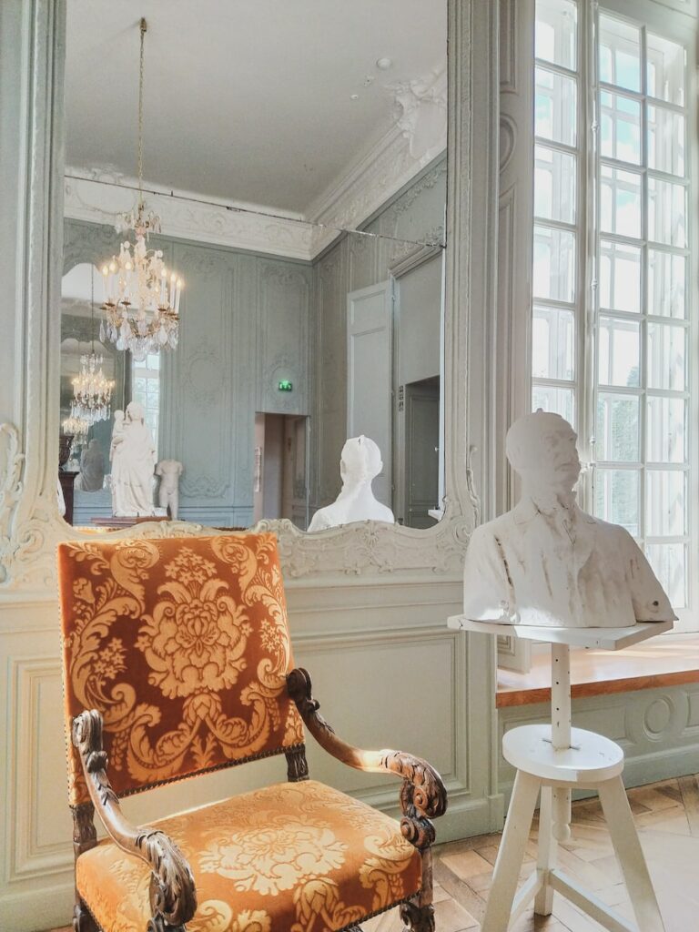 man in white dress shirt sitting on chair