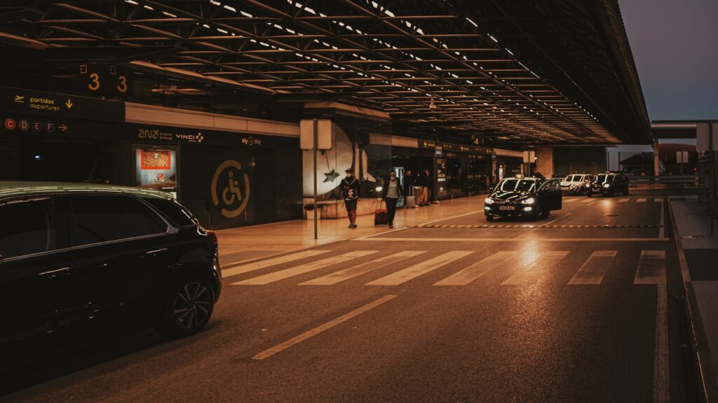 cars parked in a parking lot at night