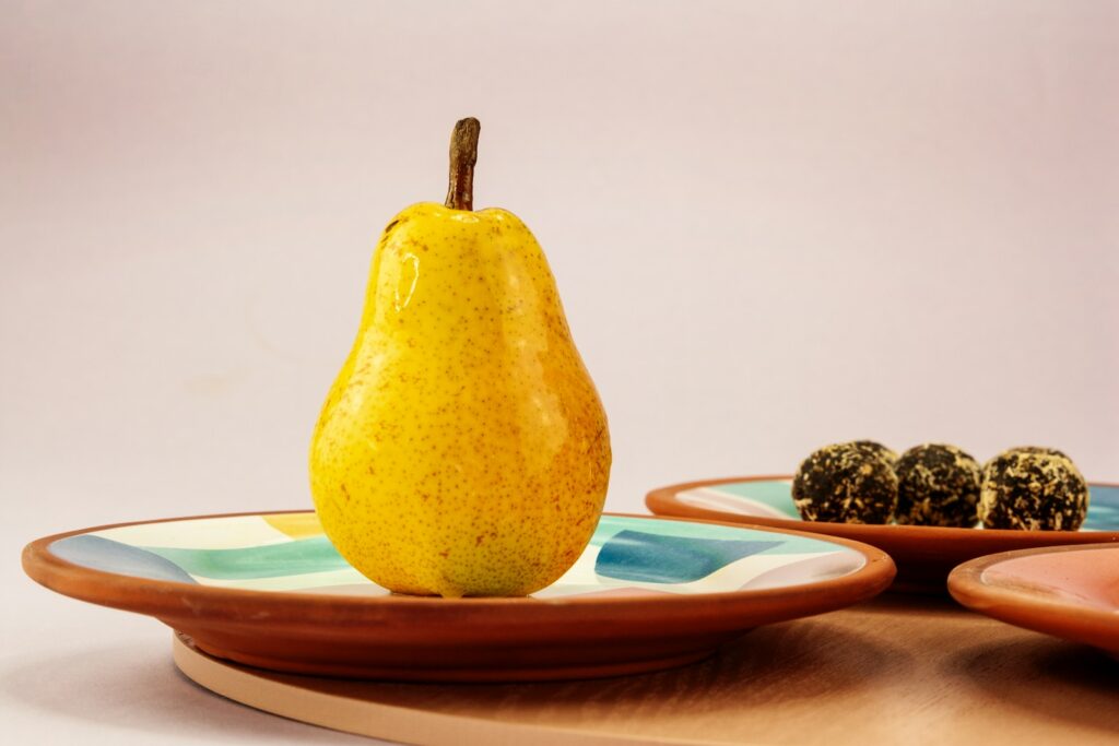 yellow fruit on white ceramic plate