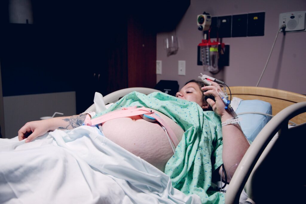 woman lying down in a hospital bed