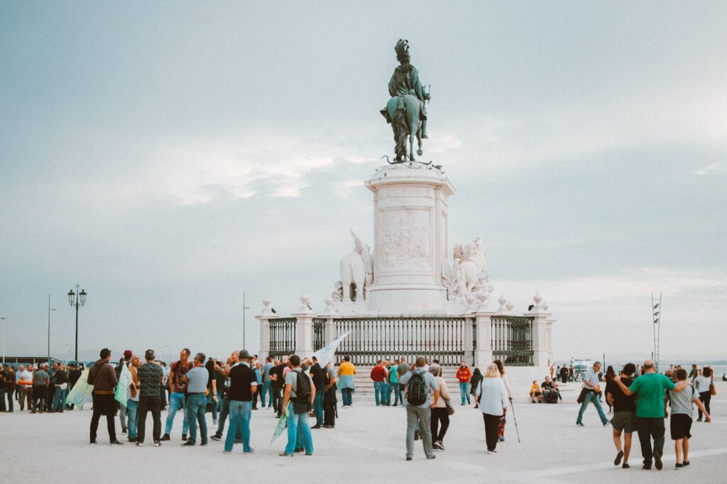 People Standing Near Statue