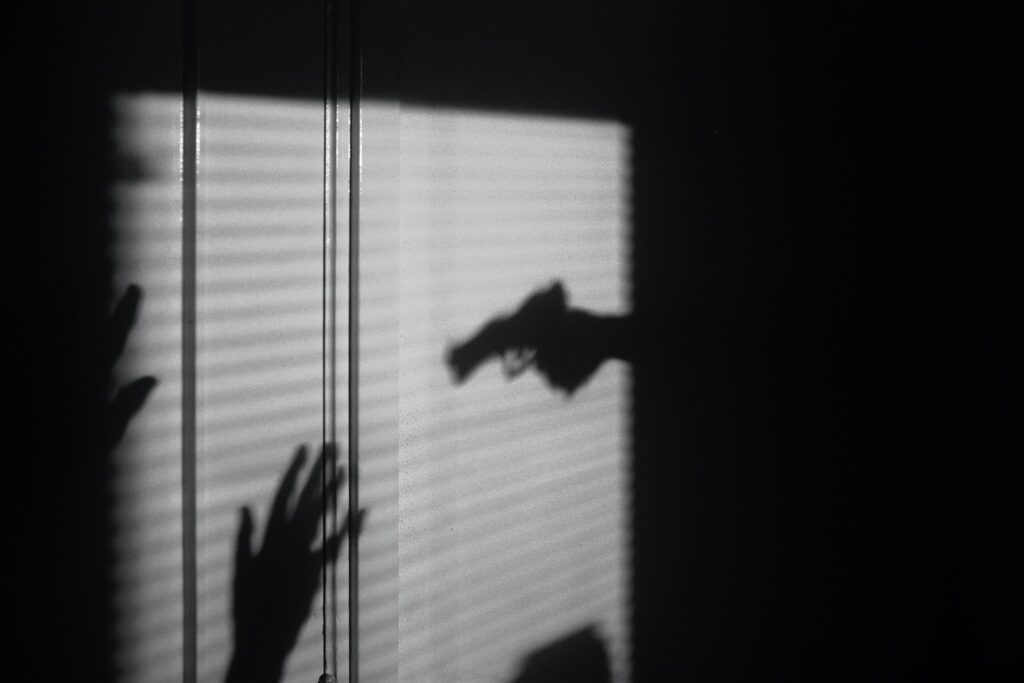 silhouette of person on window