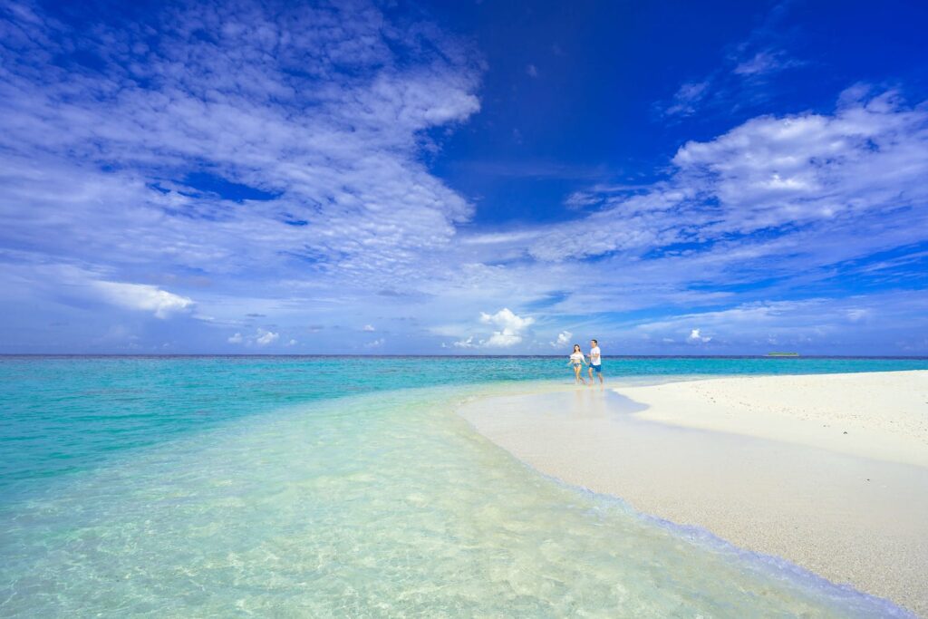 A Couple Walking on Beach