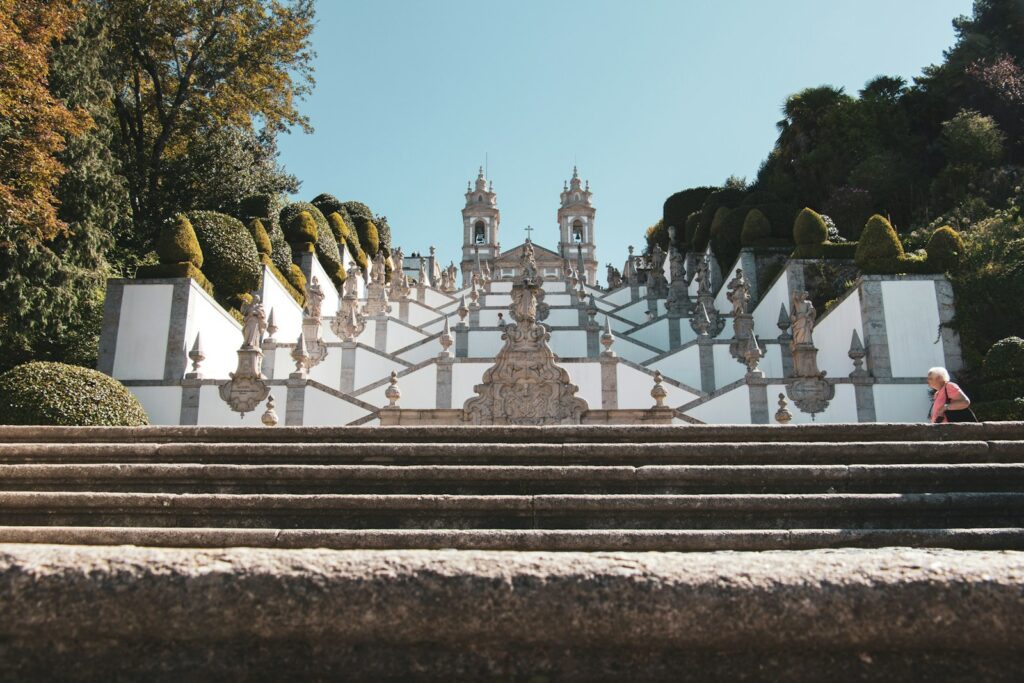 a person walking up some steps in front of a building