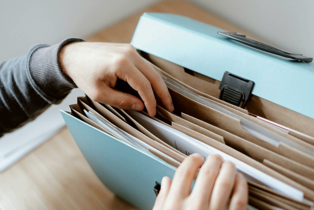 Person choosing document in folder