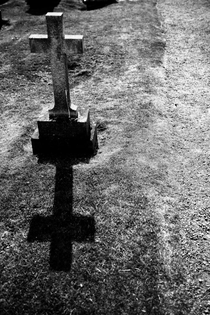 grayscale photography of gray tombstone