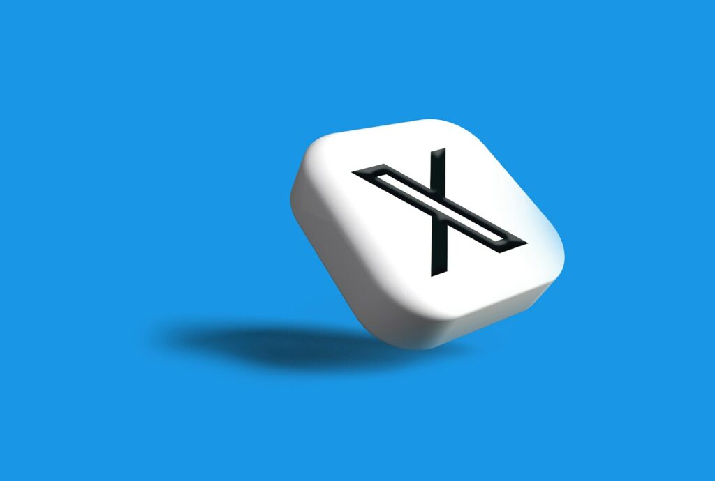 a white dice with a black x on it