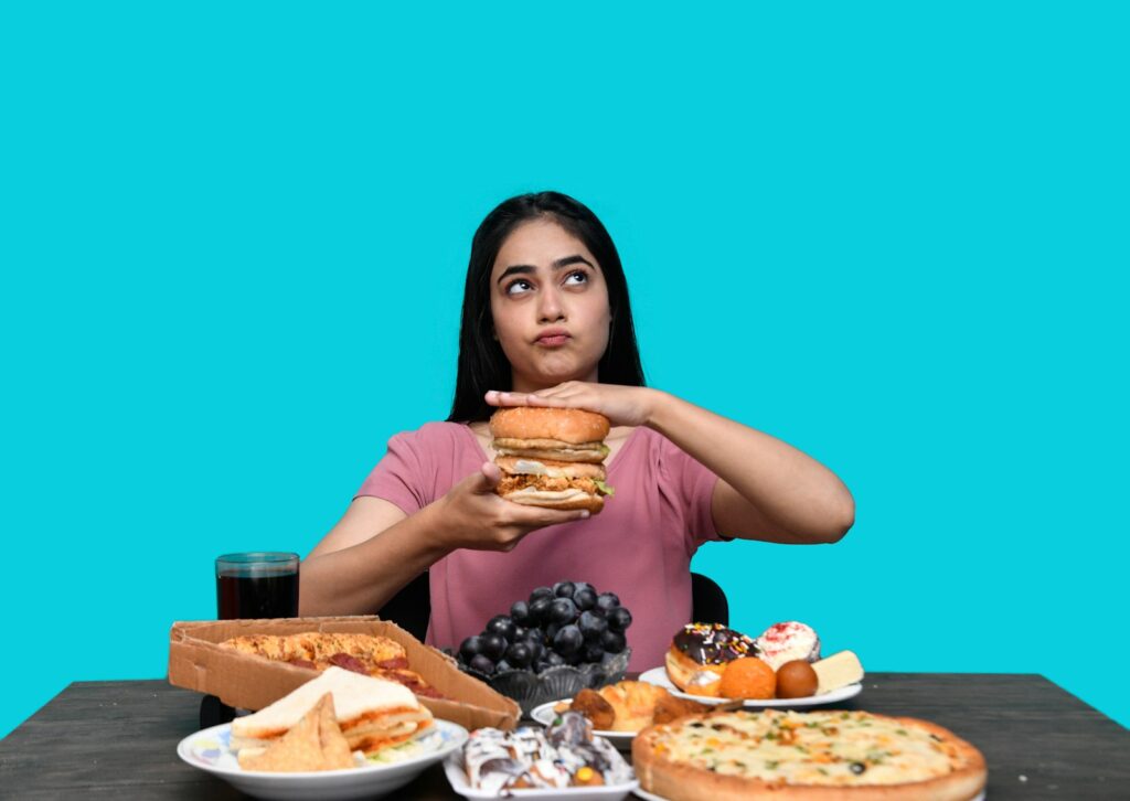a woman holding a burger